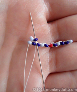 Needle up through the second earring seed bead