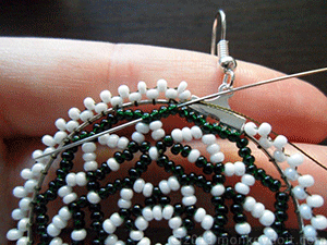 Weave the thread through a couple of beads to hide the knot 