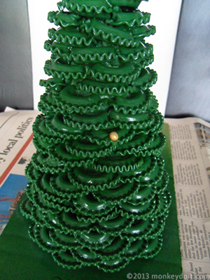 Attach the sugar decorations to branches with super glue