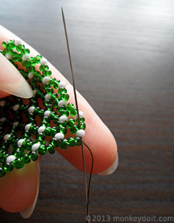 back up through the last bead of the row