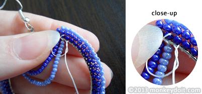 Tie a knot around the base of the closest bead