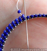 attach two beads to the same thread bridge