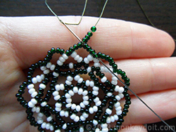 Put four beads onto the needle and push it forward through four beads