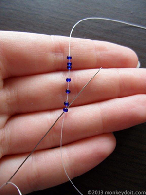 needle up through the first seed bead