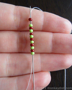 Push the needle through all the beads