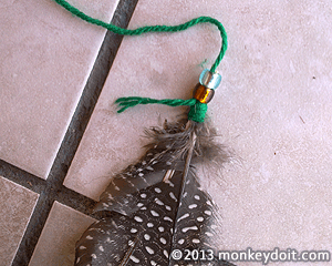 beads over the quill of the dream catcher feathers