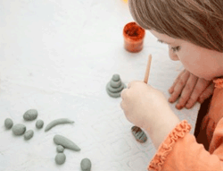 A child modeling with clay