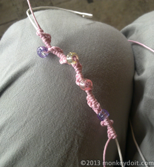 Continue around, threading a bead every 6 to 8 twists