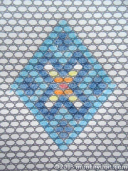 Graph paper with bead design in a diamond shape for the overall earring design