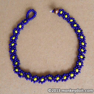 A floral chainlet / bracelet made out of beads similar in style to Native American woodland nations