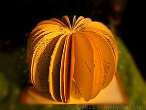 Hot glue securing the pages of the pumpkin book 