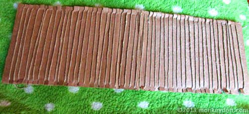 A cardboard loom