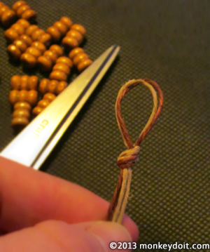 overhand knot at the looped end of the hemp cords