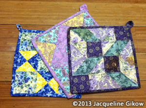 A set of quilted potholders