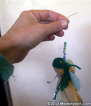Threading the fairy doll head