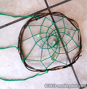Cut three pieces of wool and then tie them to your Dream Catcher